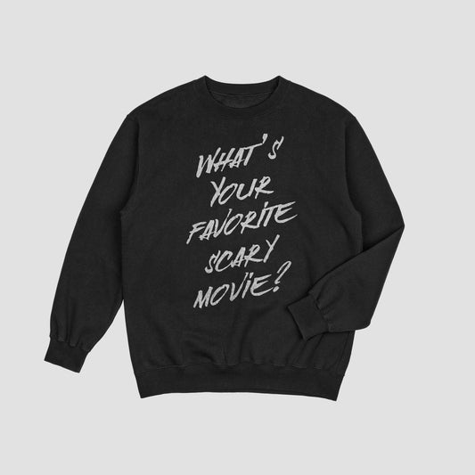 Black sweatshirt with white text 'What's Your Favorite Scary Movie?' on a light gray background