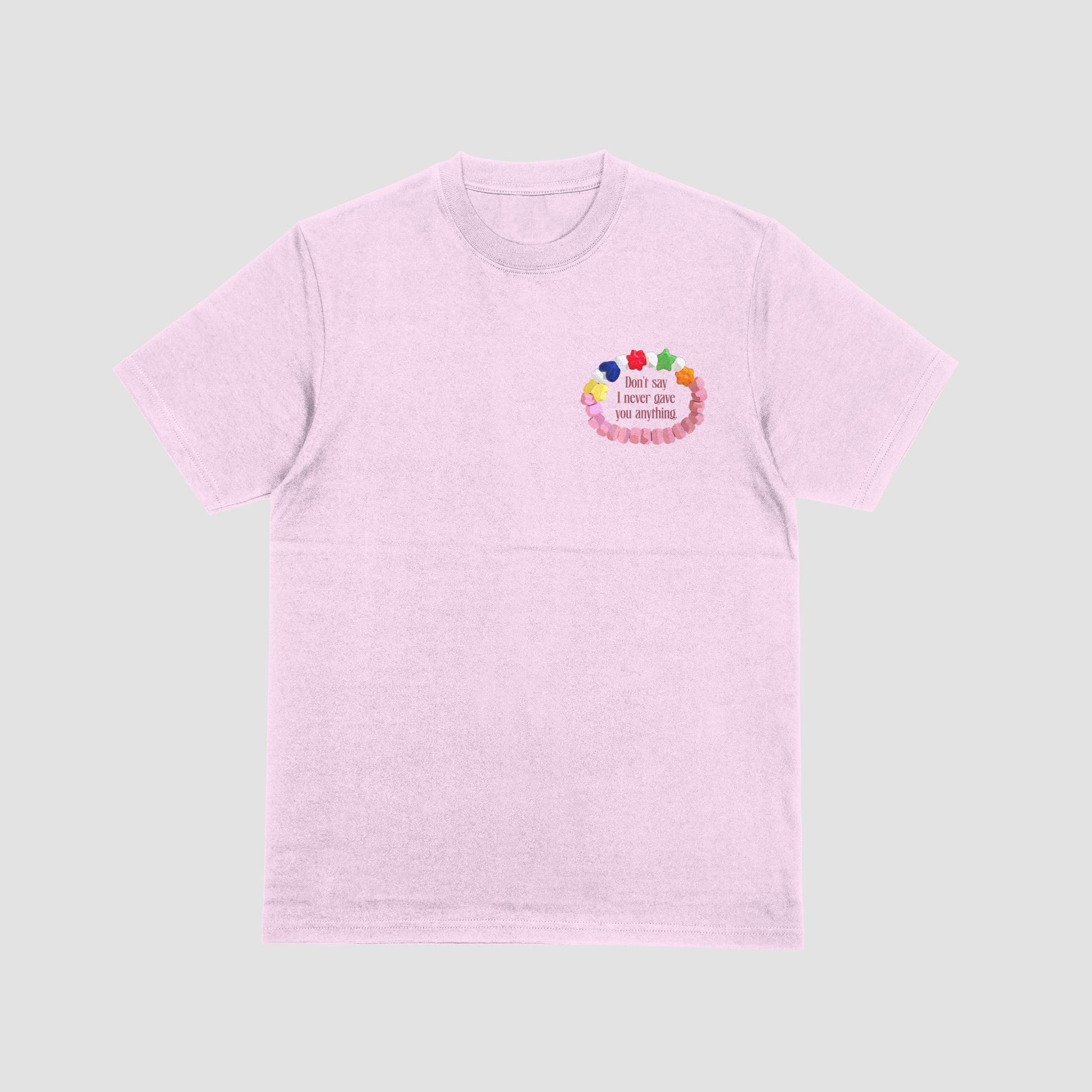 Pink t-shirt with colorful design and text on a light gray background