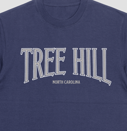 Navy blue t-shirt with 'TREE HILL NORTH CAROLINA' text in silver