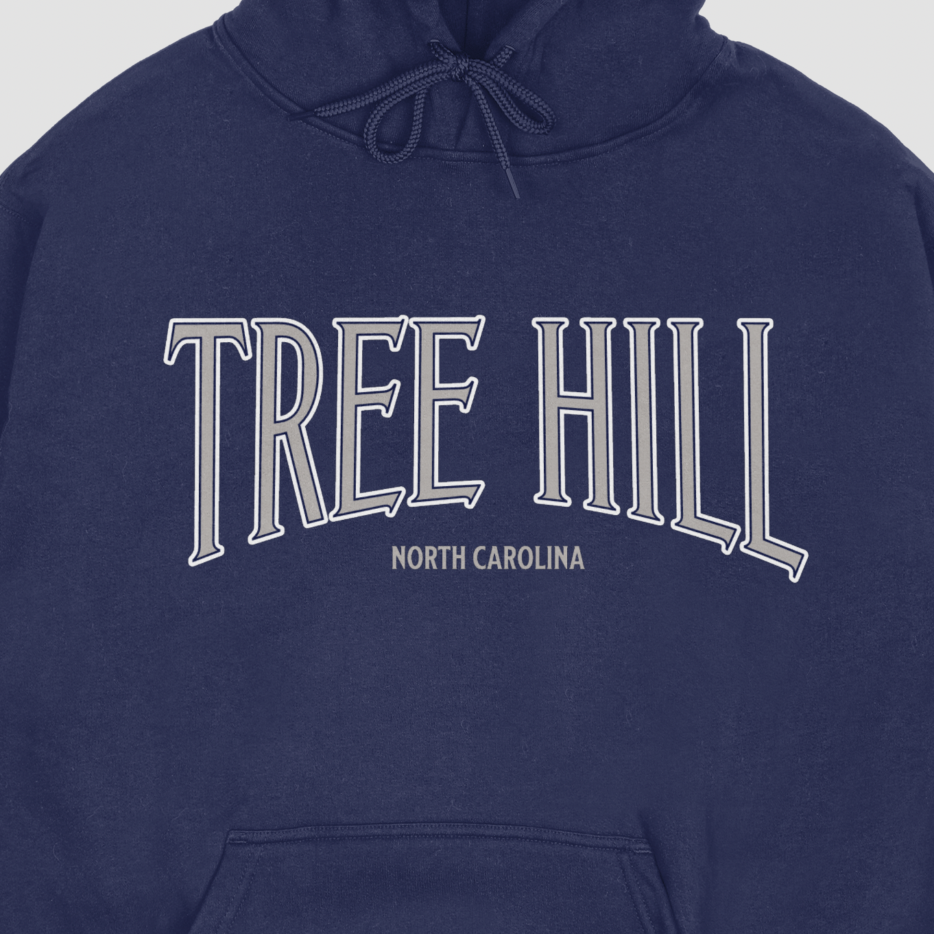 Navy blue hoodie with 'Tree Hill North Carolina' text on a white background