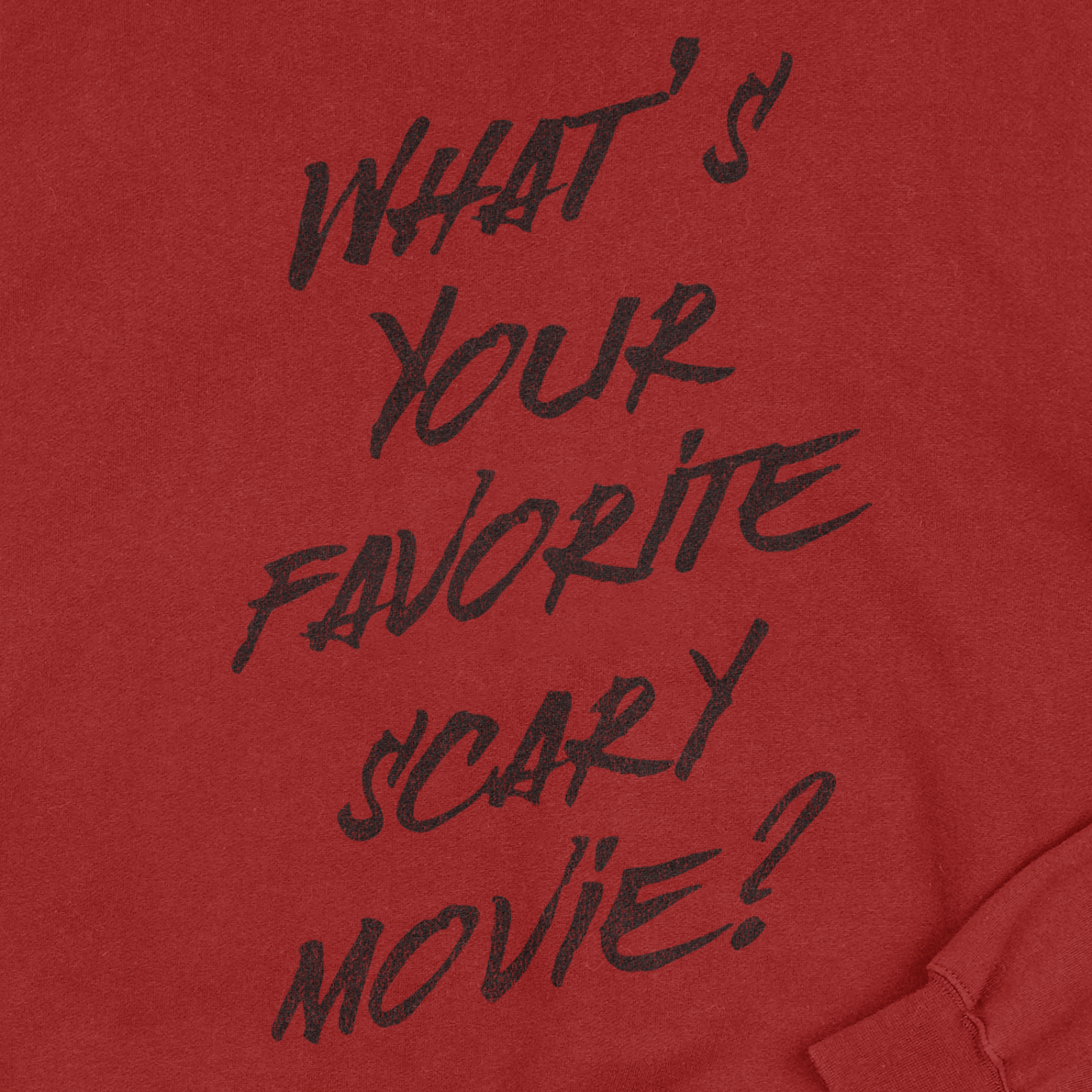 Red sweatshirt with black text 'What's Your Favorite Scary Movie?'