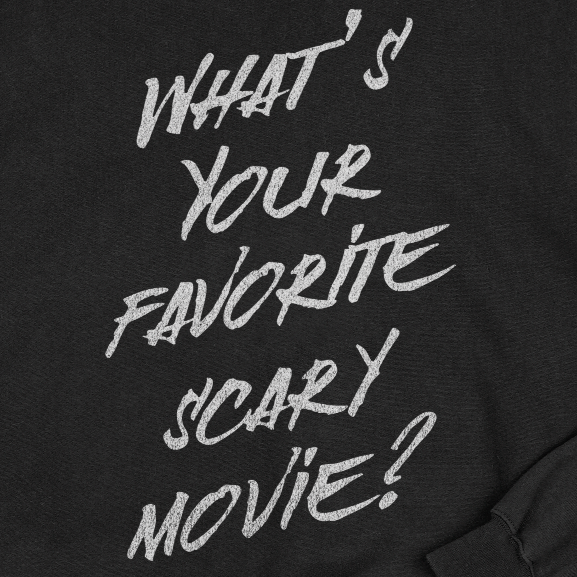 Black sweatshirt with white text 'What's Your Favorite Scary Movie?'