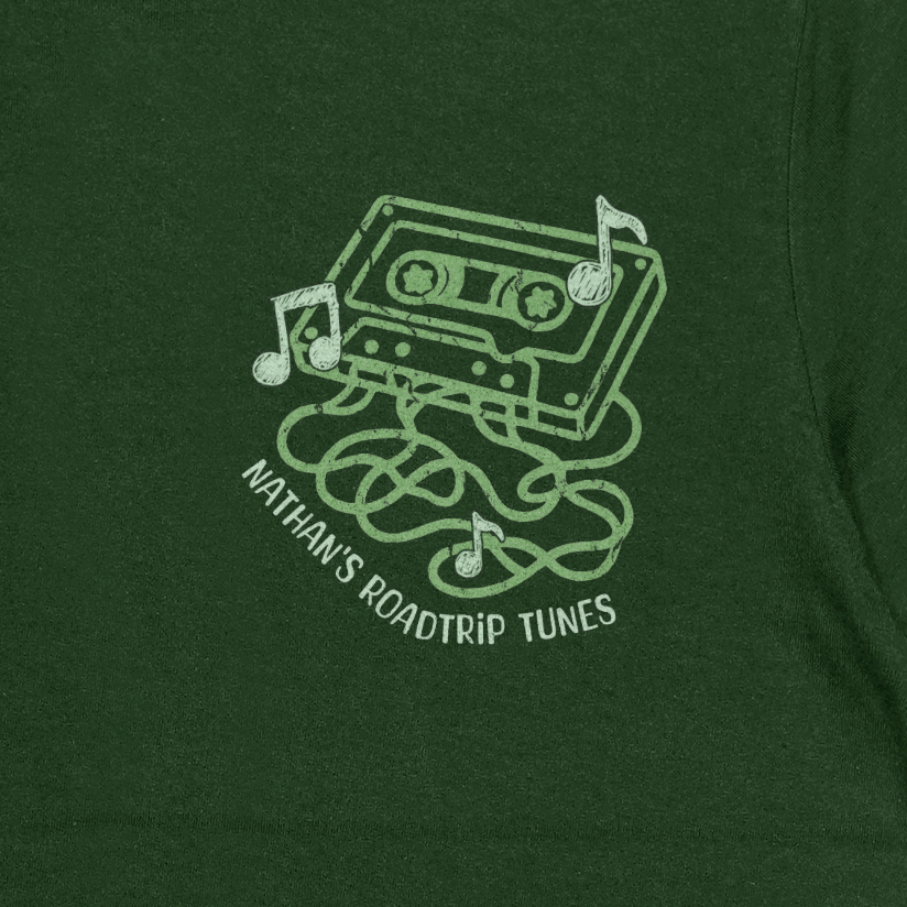 Green t-shirt with a cassette tape graphic and text on a dark green background