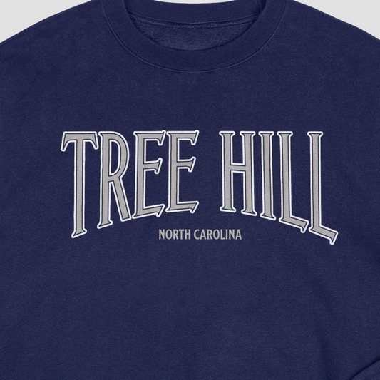 Navy blue sweatshirt with 'Tree Hill North Carolina' text in silver