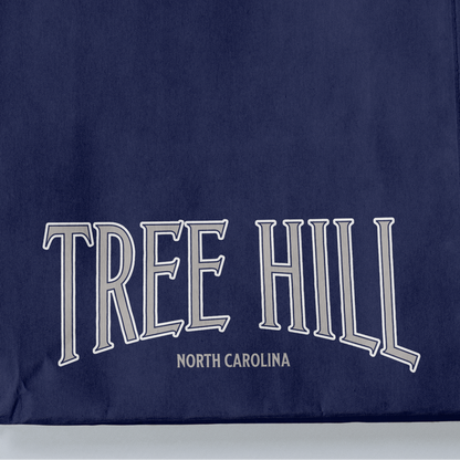 Navy blue fabric with 'TREE HILL NORTH CAROLINA' text