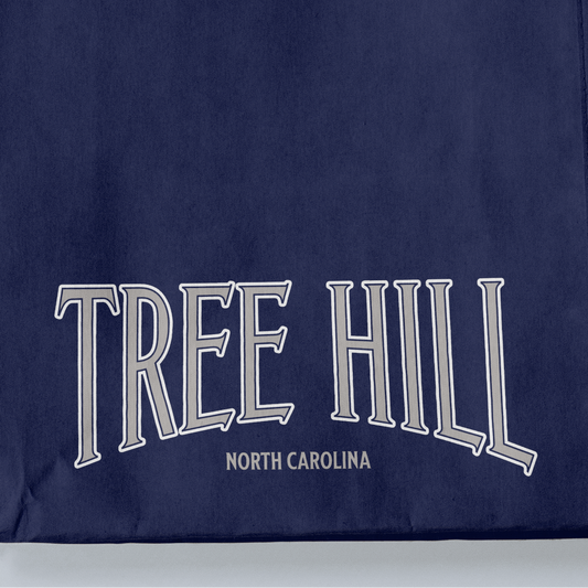 Navy blue fabric with 'TREE HILL NORTH CAROLINA' text