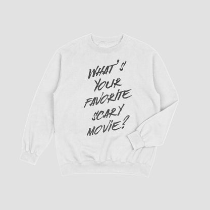 White sweatshirt with black text 'What's Your Favorite Scary Movie?' on a light gray background