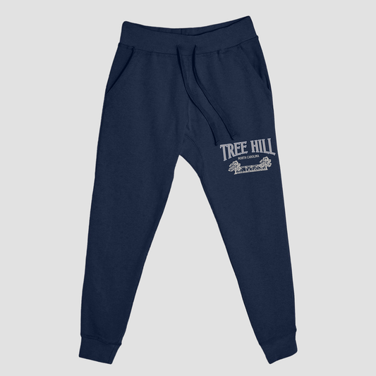 Navy blue sweatpants with 'Tree Hill' logo on a light gray background